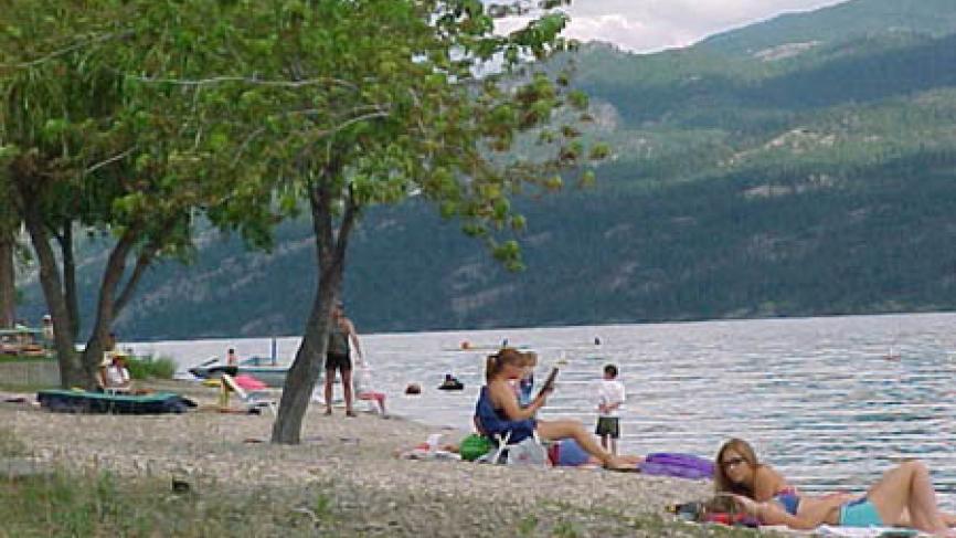 Group of people lounging on the beach.