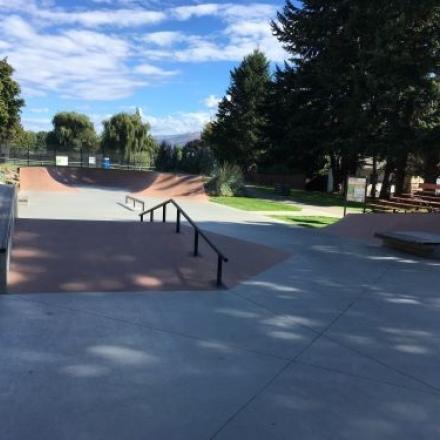 Section of skate park. There are some rails, ramps and obstacles.