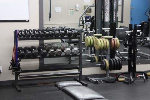 Weight rack inside a fitness room.