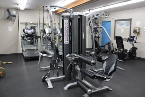 Weight machines inside a weight room.